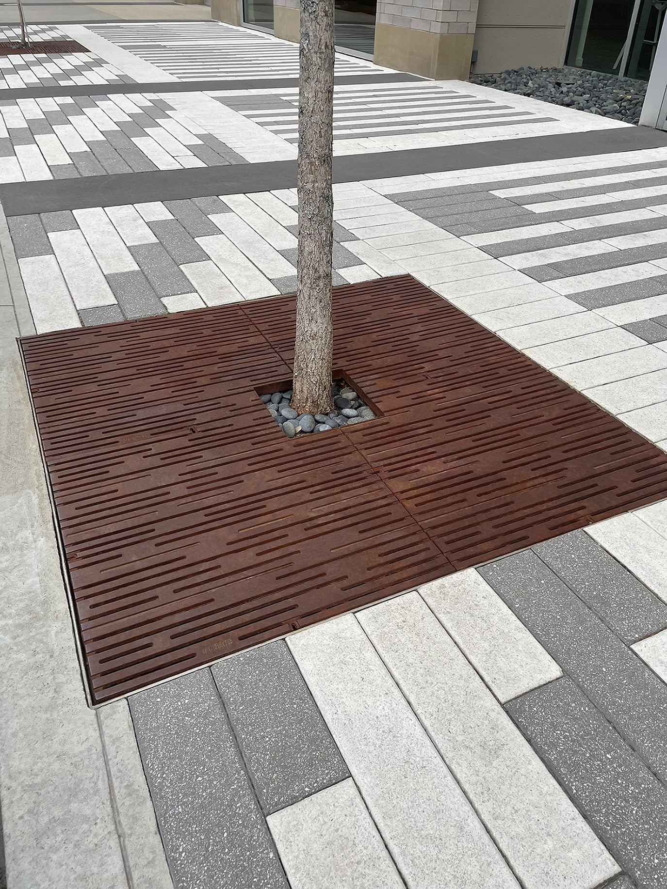 How Is the Iron Age Designs RAIN 4' x 4' Tree Grate Designed?